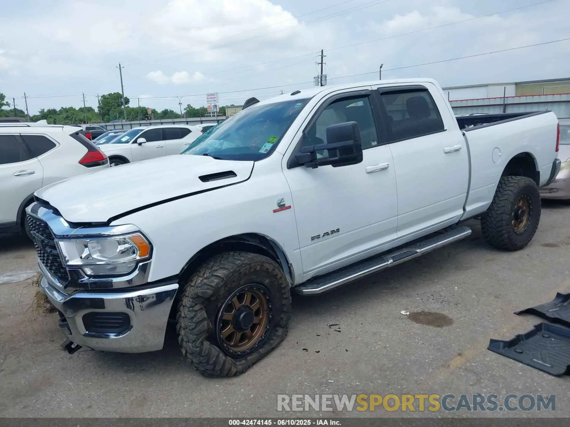 2 Photograph of a damaged car 3C6UR5DLXNG436311 RAM 2500 2022