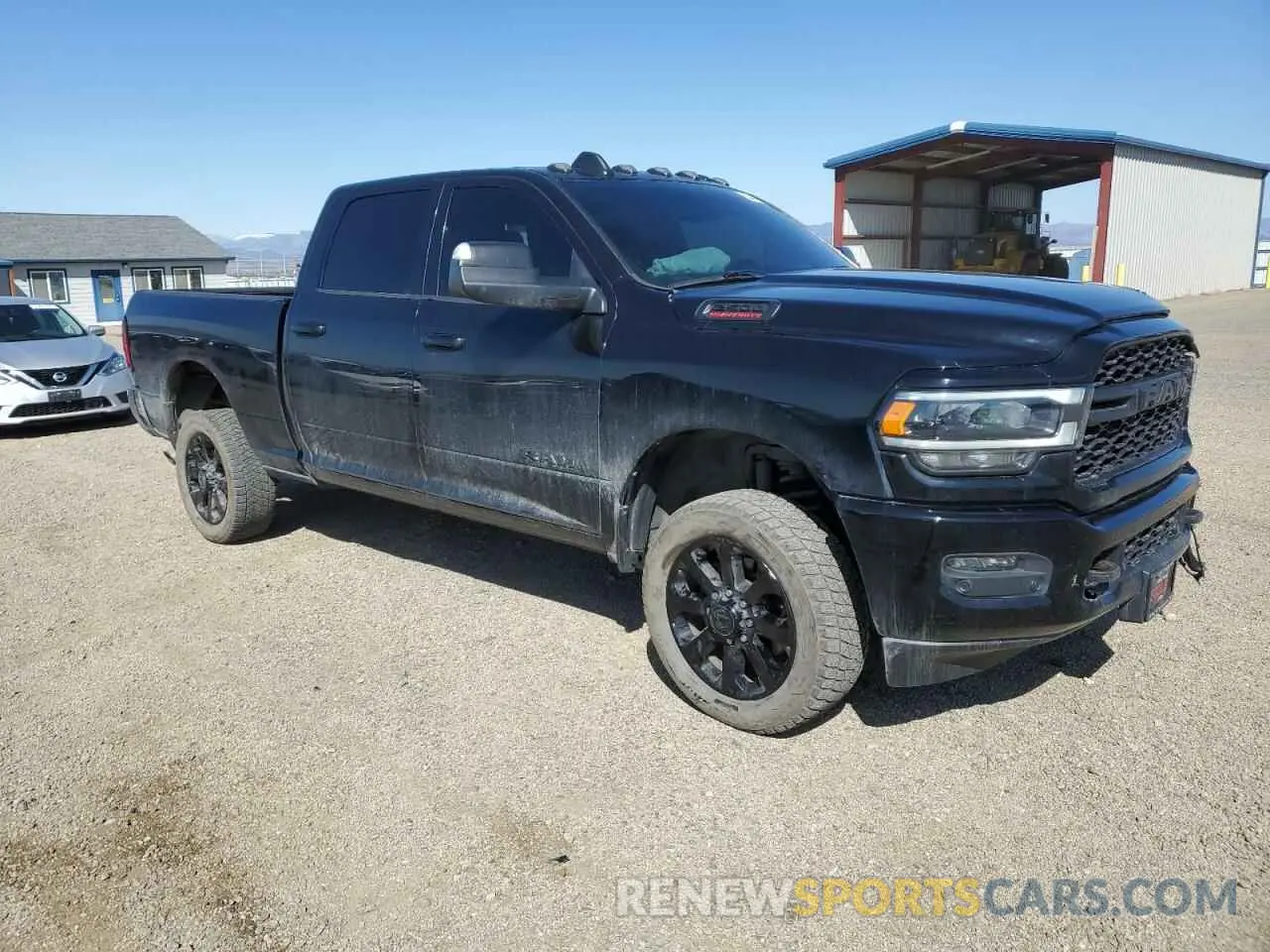 4 Photograph of a damaged car 3C6UR5FL1NG335574 RAM 2500 2022