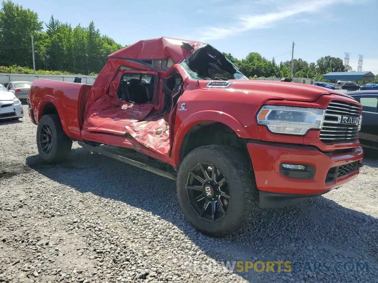 4 Photograph of a damaged car 3C6UR5FL5NG212540 RAM 2500 2022