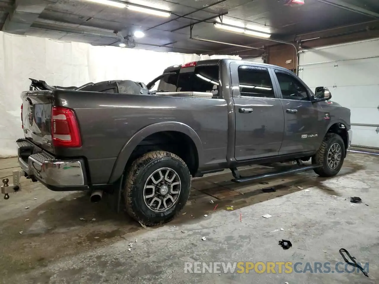 3 Photograph of a damaged car 3C6UR5GL8NG193514 RAM 2500 2022