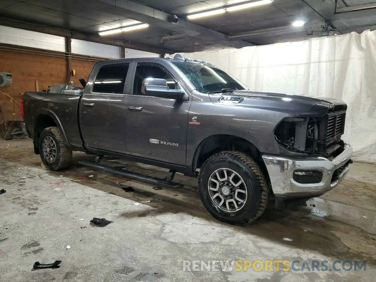 4 Photograph of a damaged car 3C6UR5GL8NG193514 RAM 2500 2022