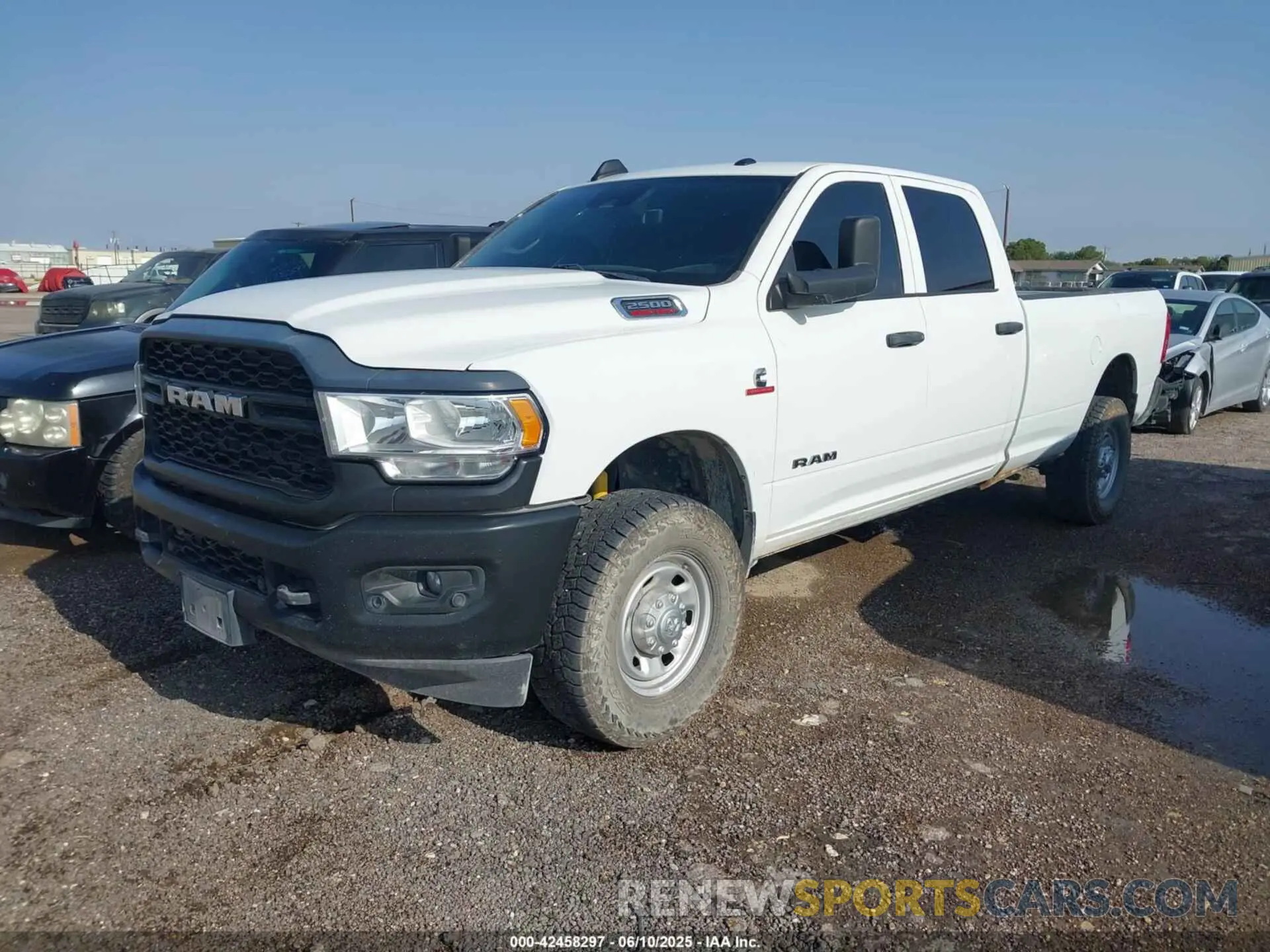 2 Photograph of a damaged car 3C6UR5HL8NG202498 RAM 2500 2022