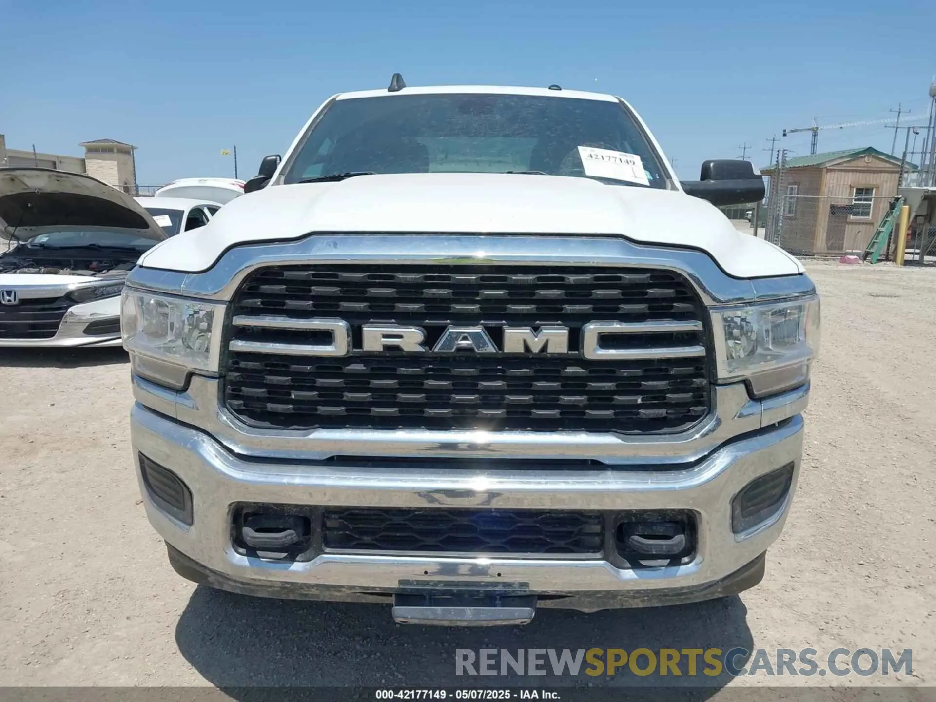 6 Photograph of a damaged car 3C6UR5JL1NG104343 RAM 2500 2022