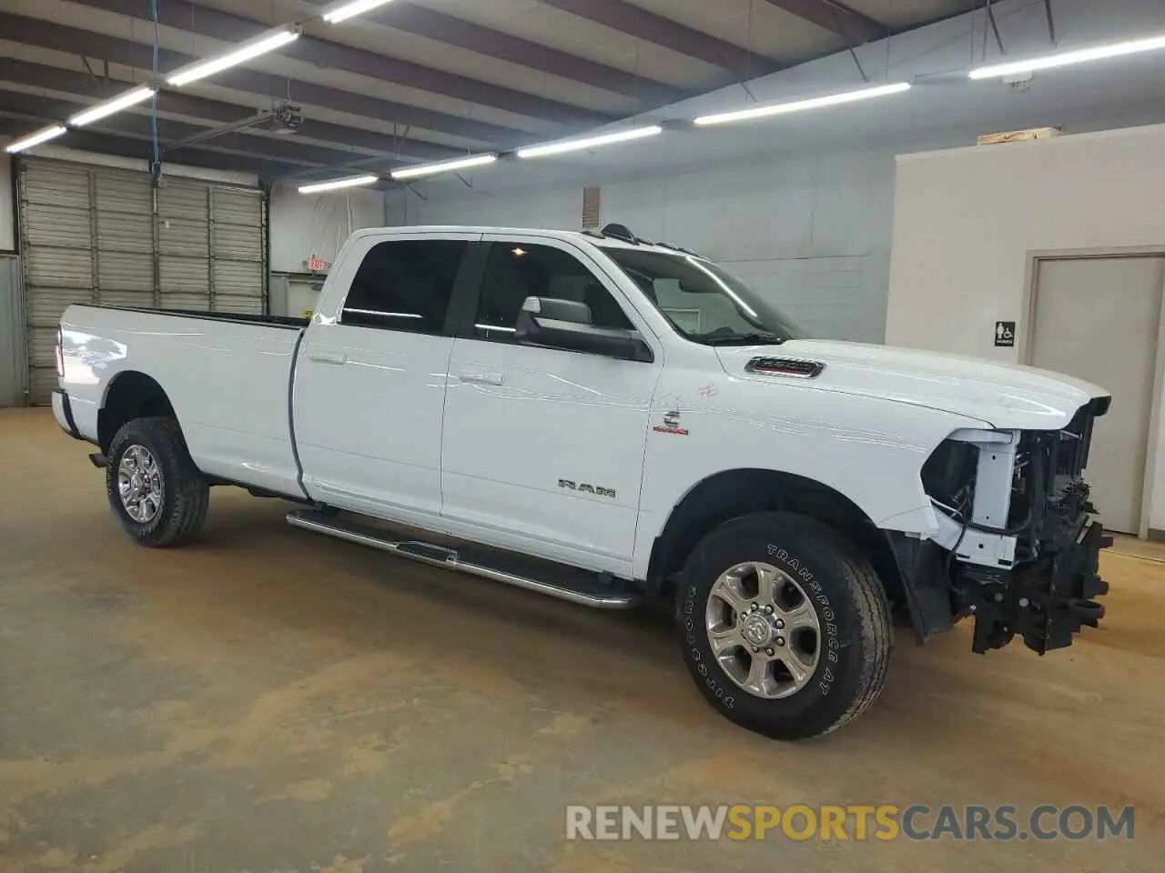 4 Photograph of a damaged car 3C6UR5JL4NG343756 RAM 2500 2022
