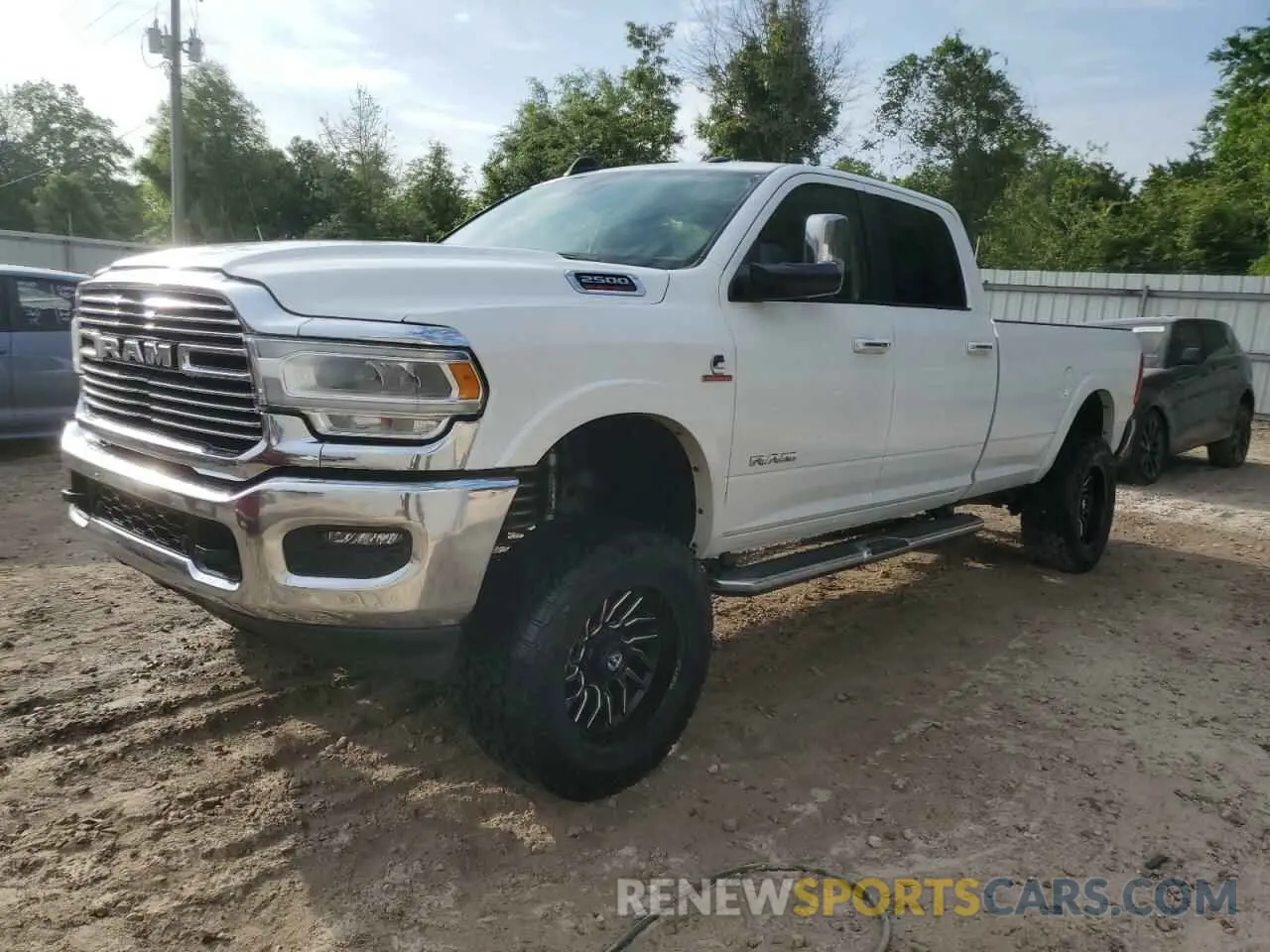 1 Photograph of a damaged car 3C6UR5KL8NG423172 RAM 2500 2022