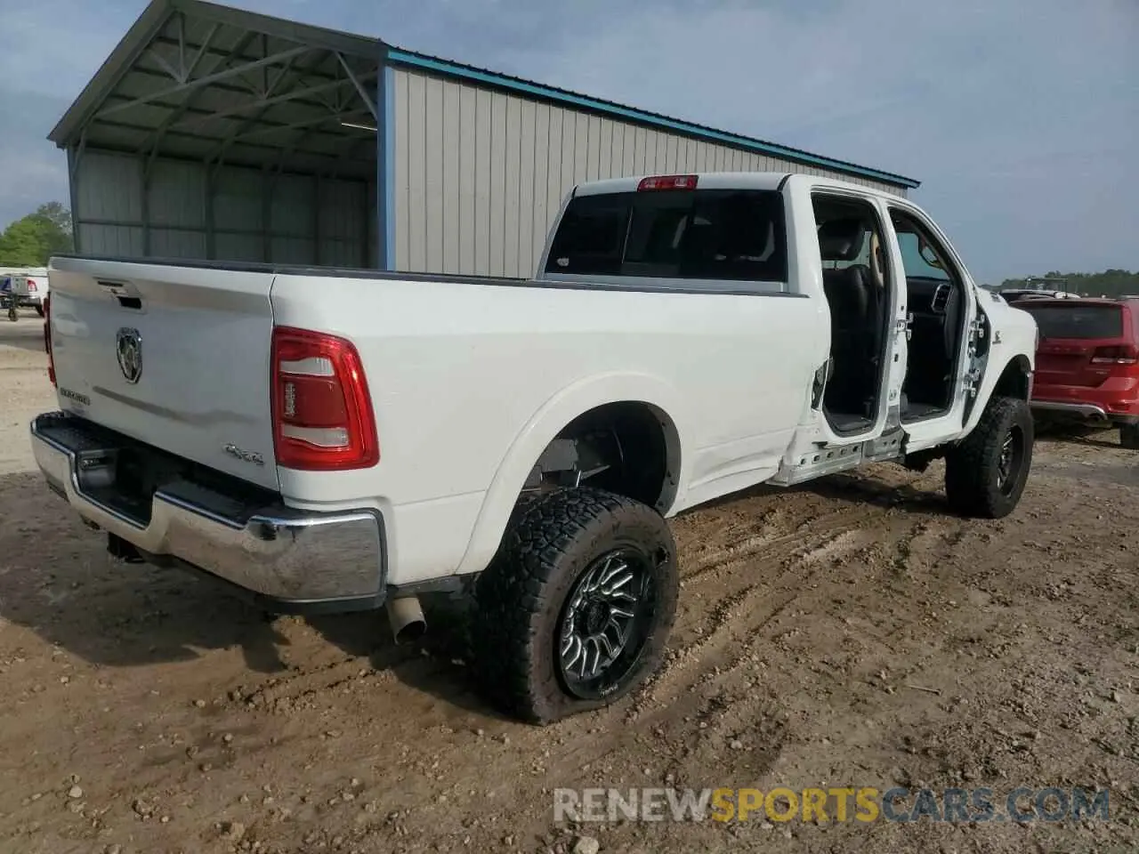 3 Photograph of a damaged car 3C6UR5KL8NG423172 RAM 2500 2022