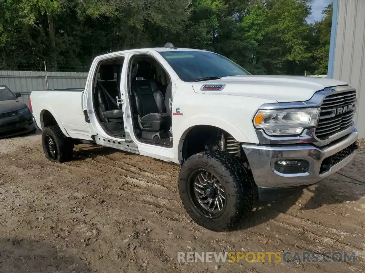 4 Photograph of a damaged car 3C6UR5KL8NG423172 RAM 2500 2022