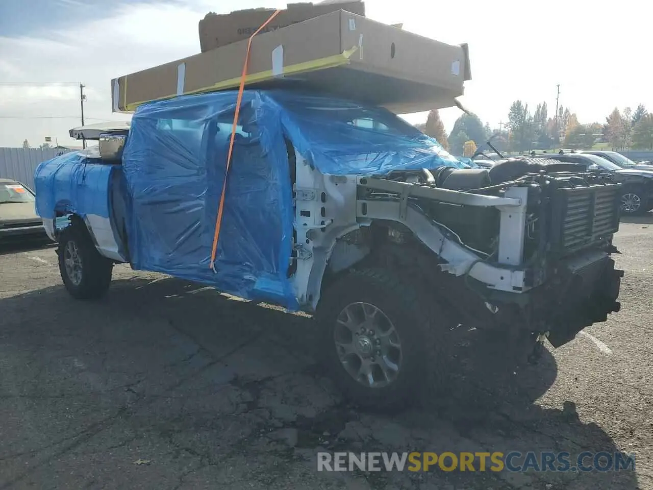 4 Photograph of a damaged car 3C6UR5NL7NG222536 RAM 2500 2022