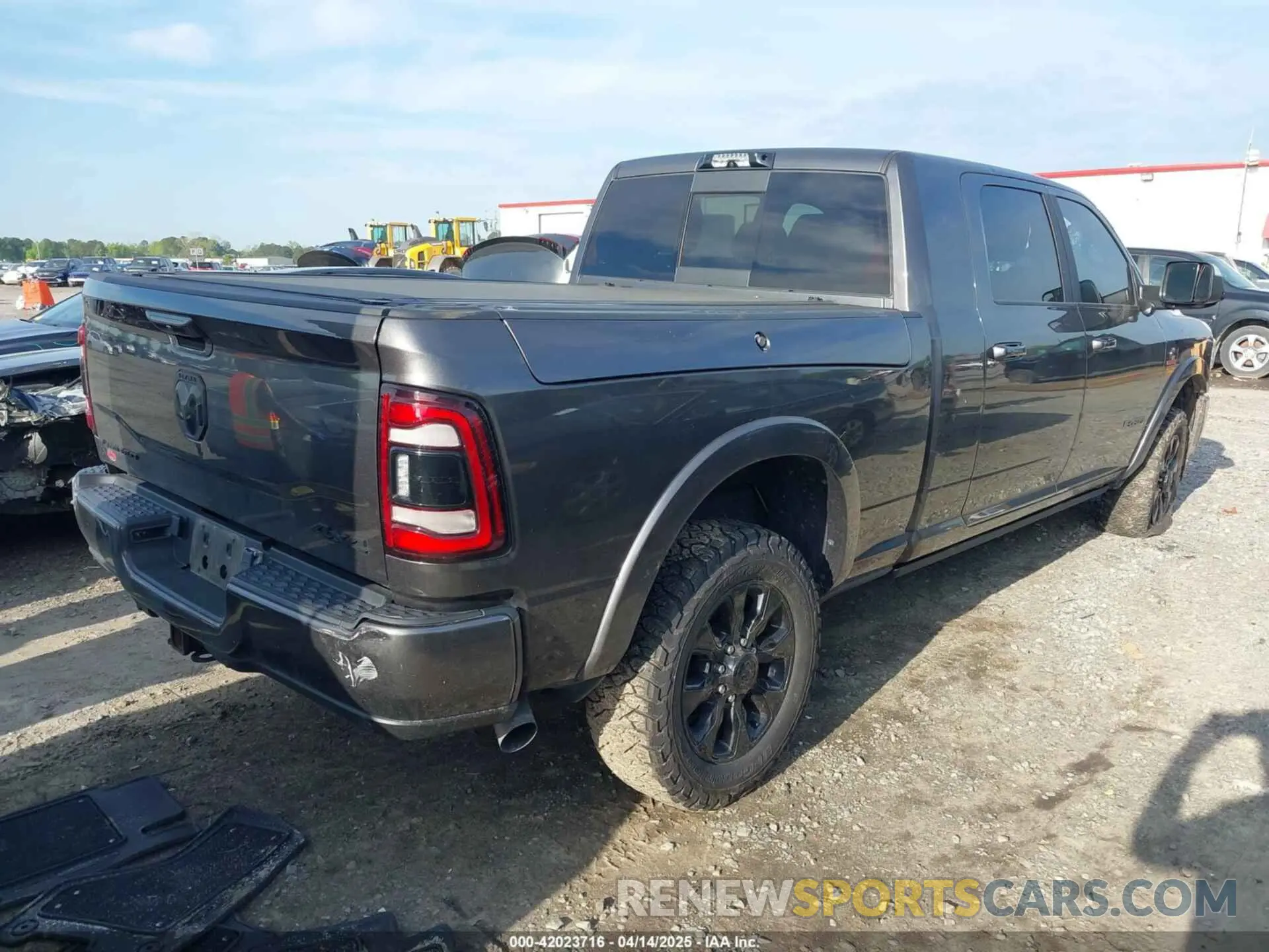 4 Photograph of a damaged car 3C6UR5TL9NG195293 RAM 2500 2022