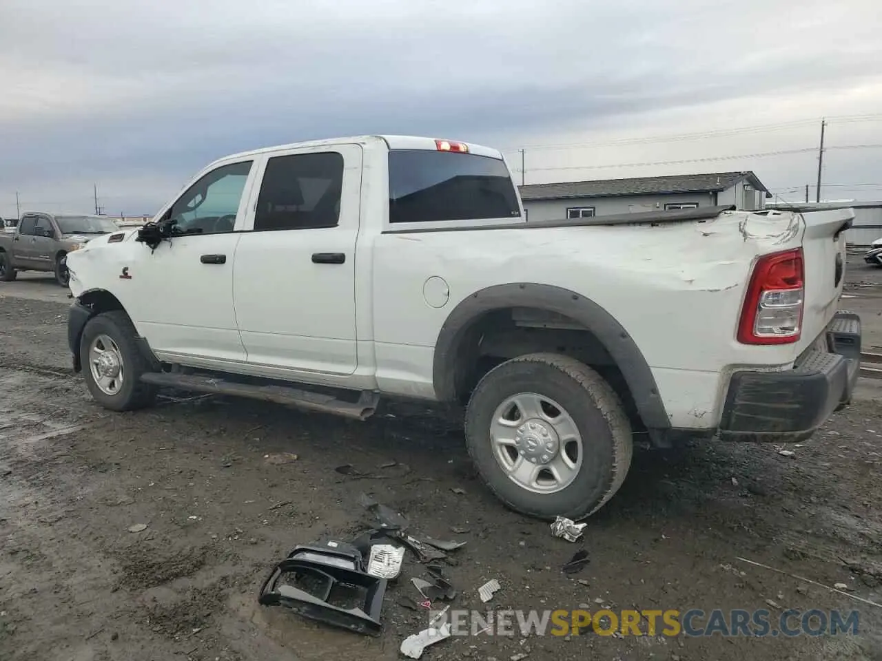 2 Photograph of a damaged car 3C6UR5CL3PG582280 RAM 2500 2023