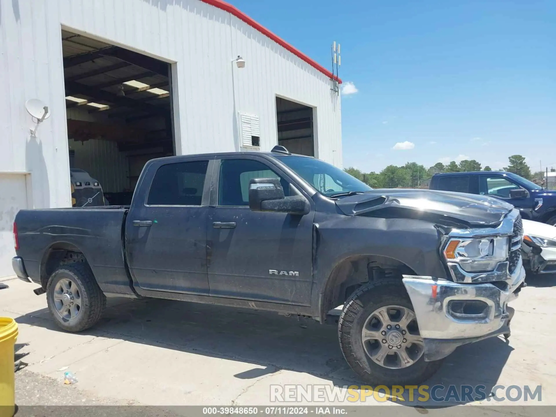 13 Photograph of a damaged car 3C6UR5DJ5PG548743 RAM 2500 2023