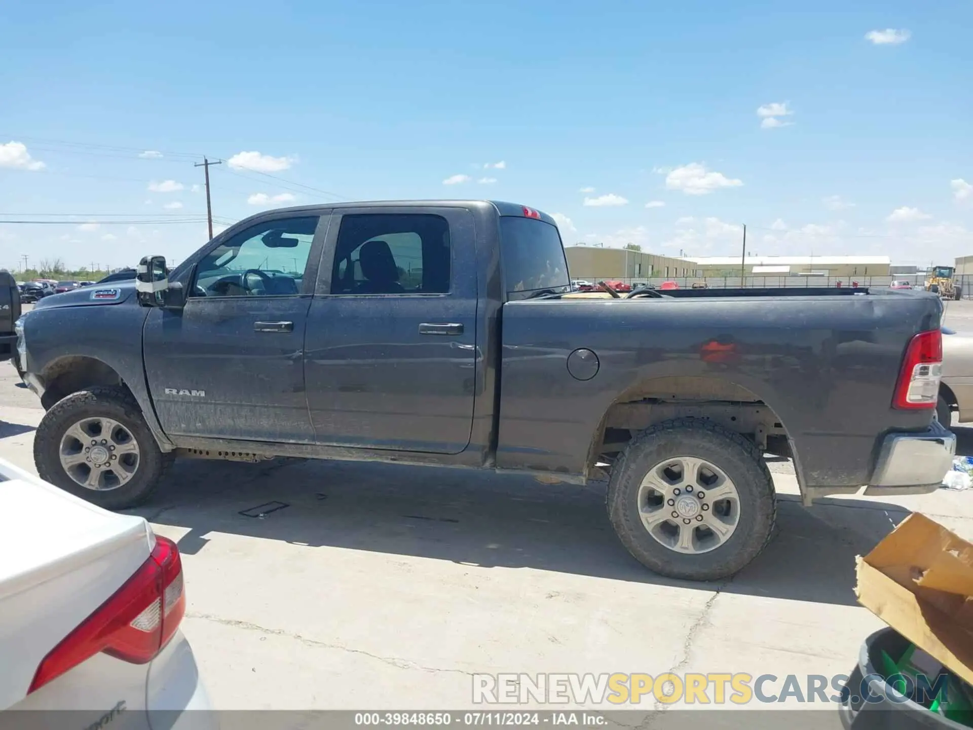14 Photograph of a damaged car 3C6UR5DJ5PG548743 RAM 2500 2023