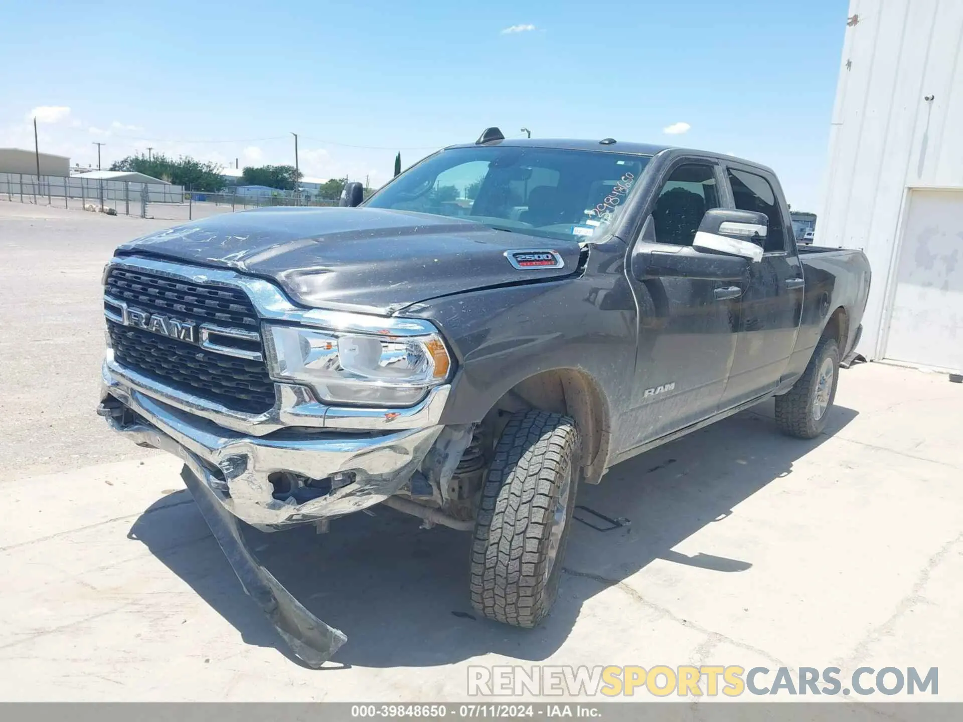 2 Photograph of a damaged car 3C6UR5DJ5PG548743 RAM 2500 2023