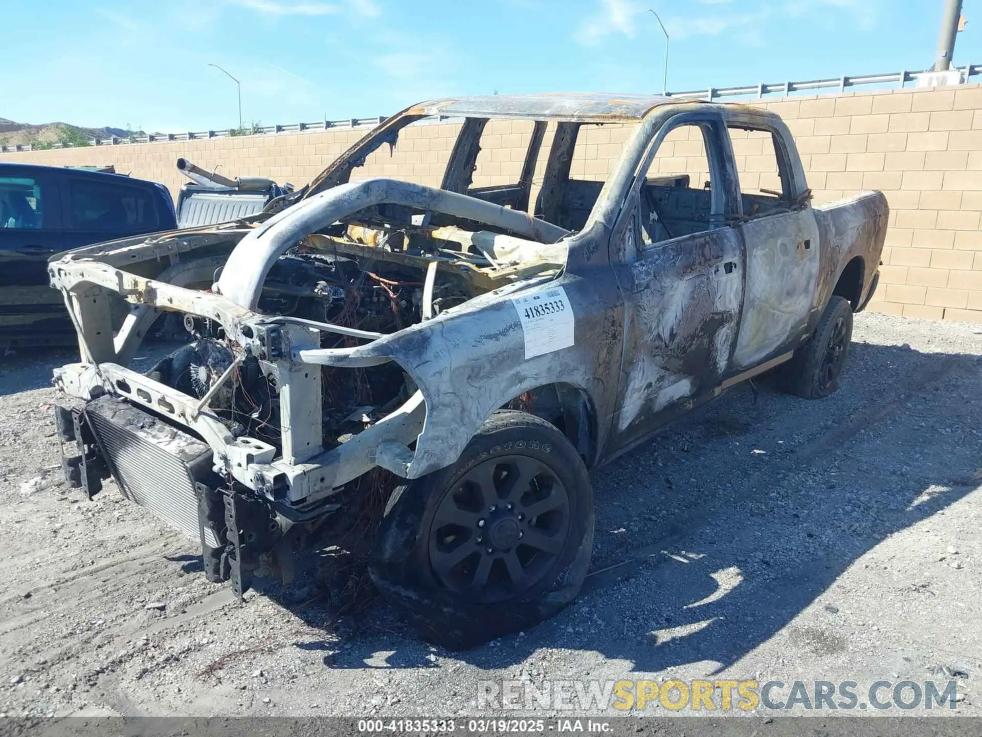 2 Photograph of a damaged car 3C6UR5DL5PG514867 RAM 2500 2023