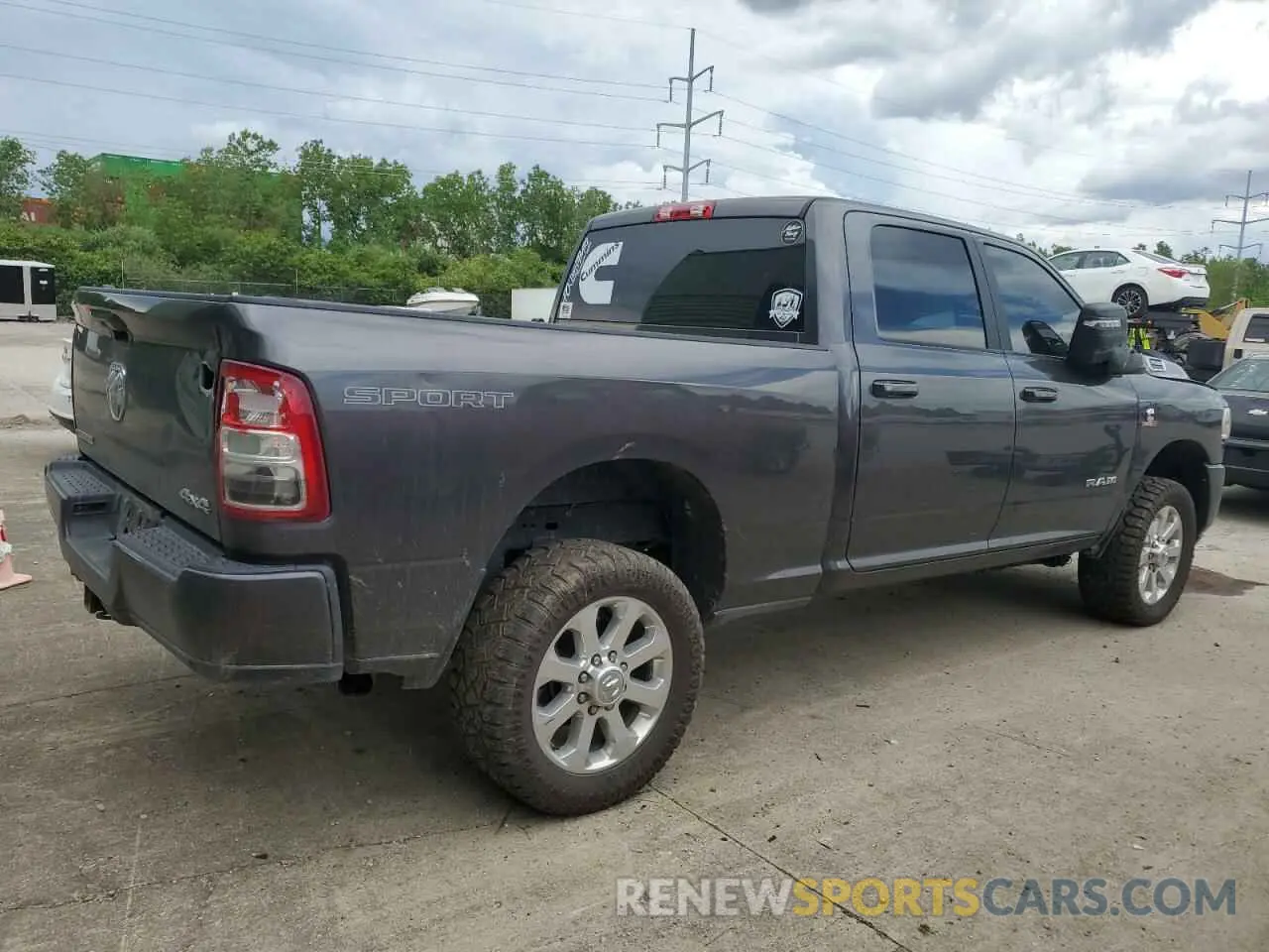 3 Photograph of a damaged car 3C6UR5DL7PG517320 RAM 2500 2023