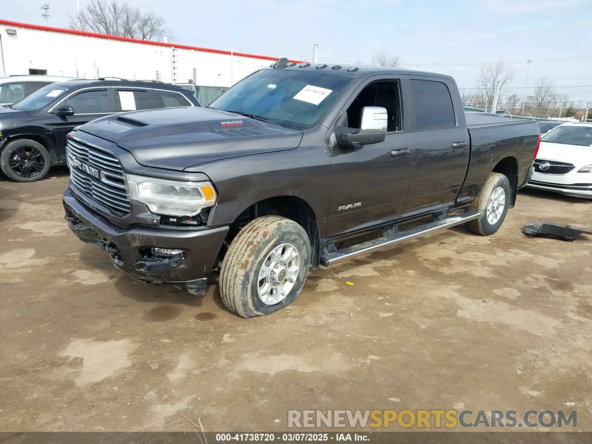 2 Photograph of a damaged car 3C6UR5FJ6PG614424 RAM 2500 2023
