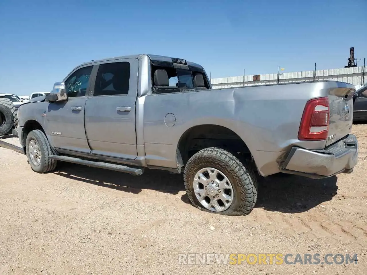 2 Photograph of a damaged car 3C6UR5FL3PG517747 RAM 2500 2023