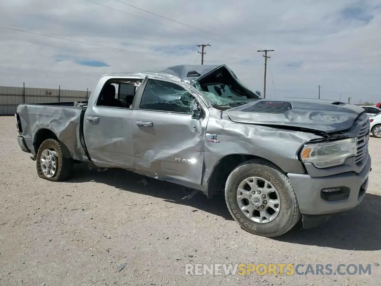 4 Photograph of a damaged car 3C6UR5FL3PG517747 RAM 2500 2023