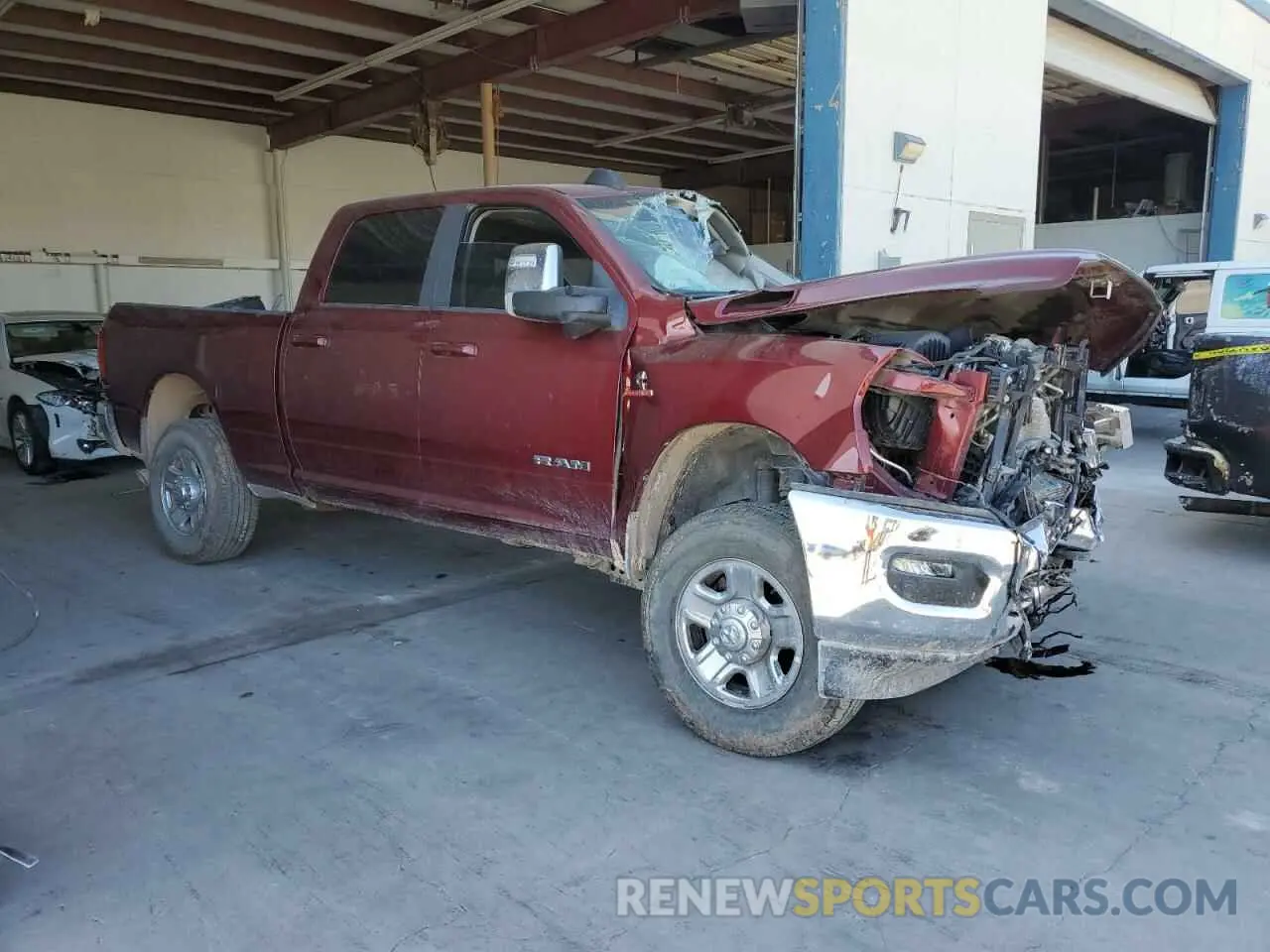 4 Photograph of a damaged car 3C6UR5FL6PG569132 RAM 2500 2023