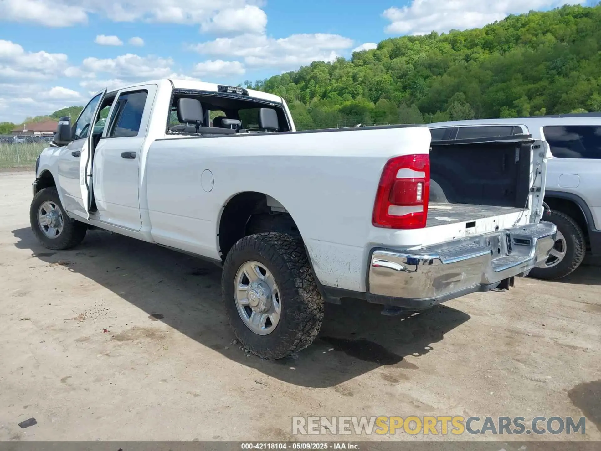 3 Photograph of a damaged car 3C6UR5HJ9PG564714 RAM 2500 2023