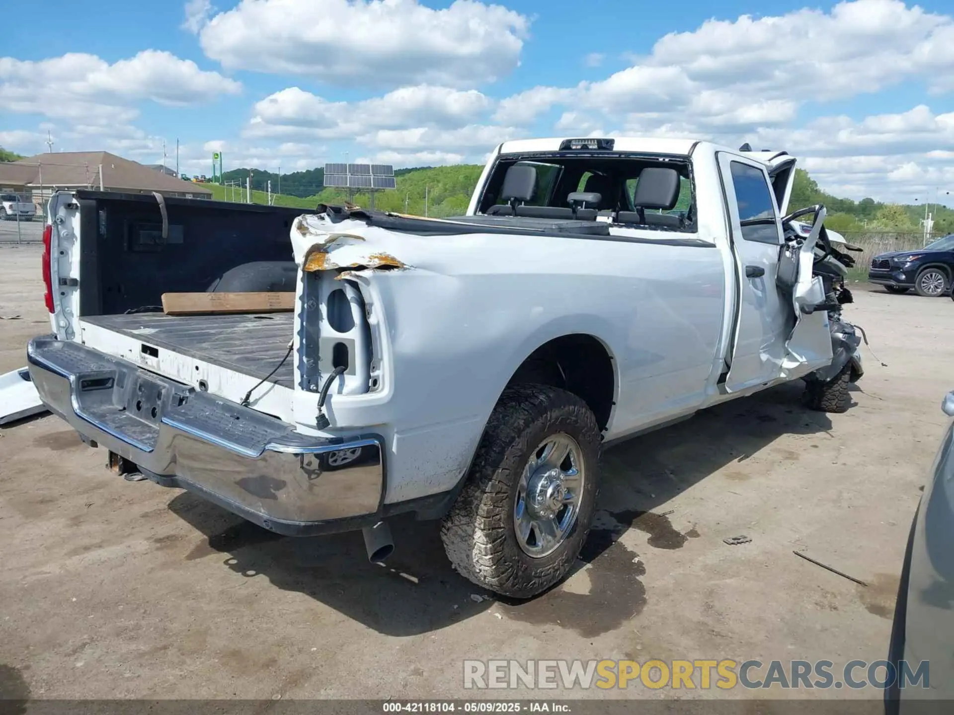 4 Photograph of a damaged car 3C6UR5HJ9PG564714 RAM 2500 2023
