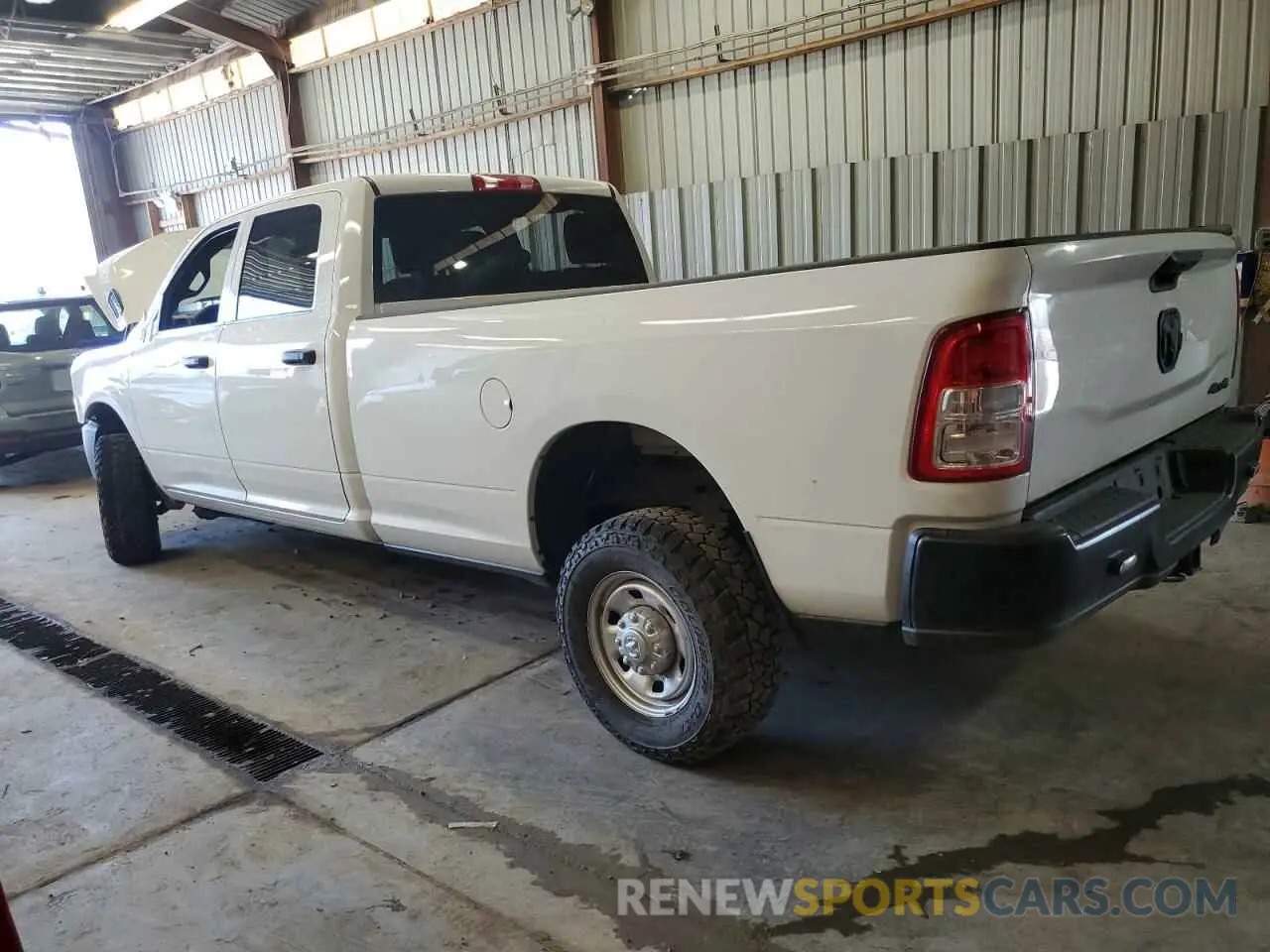 2 Photograph of a damaged car 3C6UR5HJ9PG587488 RAM 2500 2023