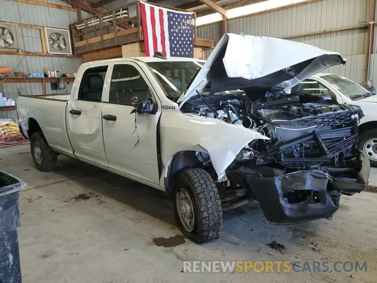 4 Photograph of a damaged car 3C6UR5HJ9PG587488 RAM 2500 2023