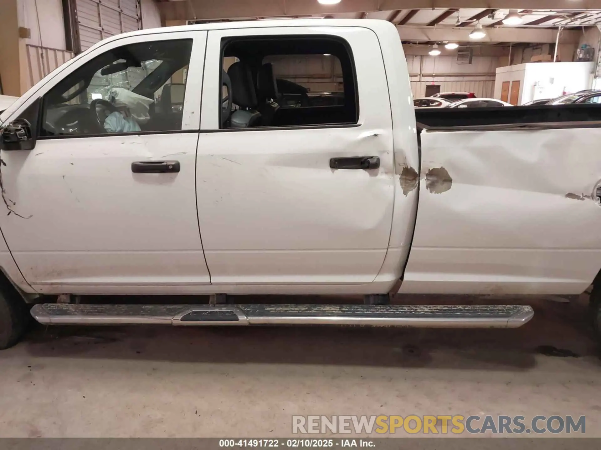 14 Photograph of a damaged car 3C6UR5HL0PG529660 RAM 2500 2023