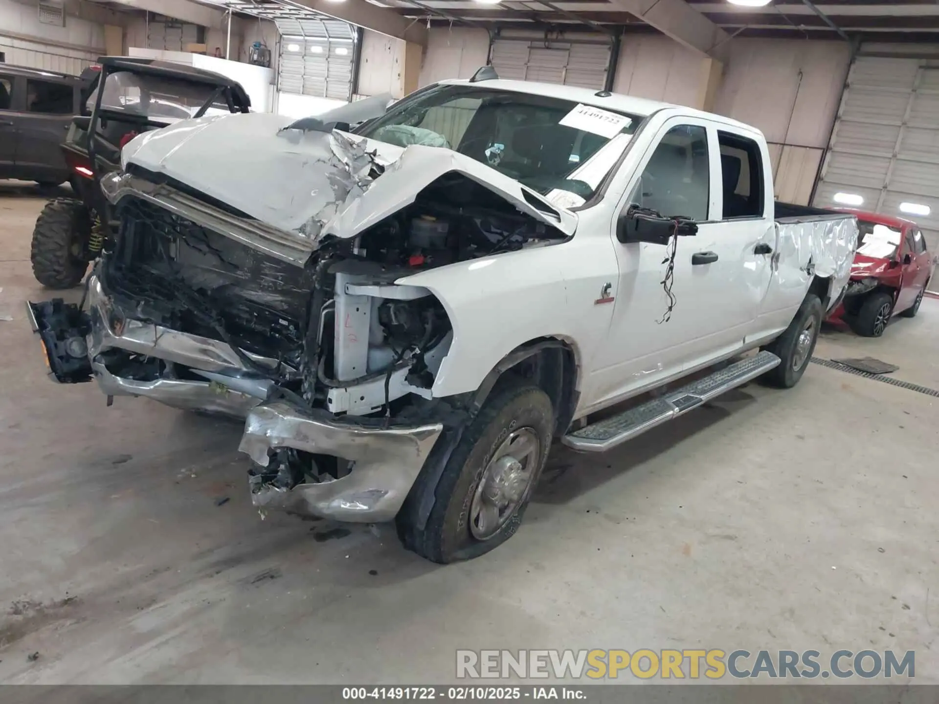 2 Photograph of a damaged car 3C6UR5HL0PG529660 RAM 2500 2023