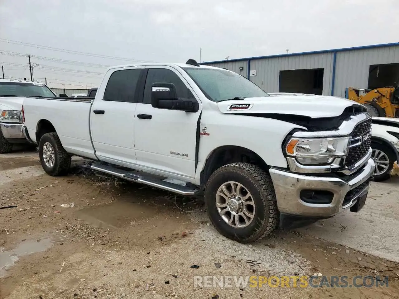 4 Photograph of a damaged car 3C6UR5JL3PG576451 RAM 2500 2023