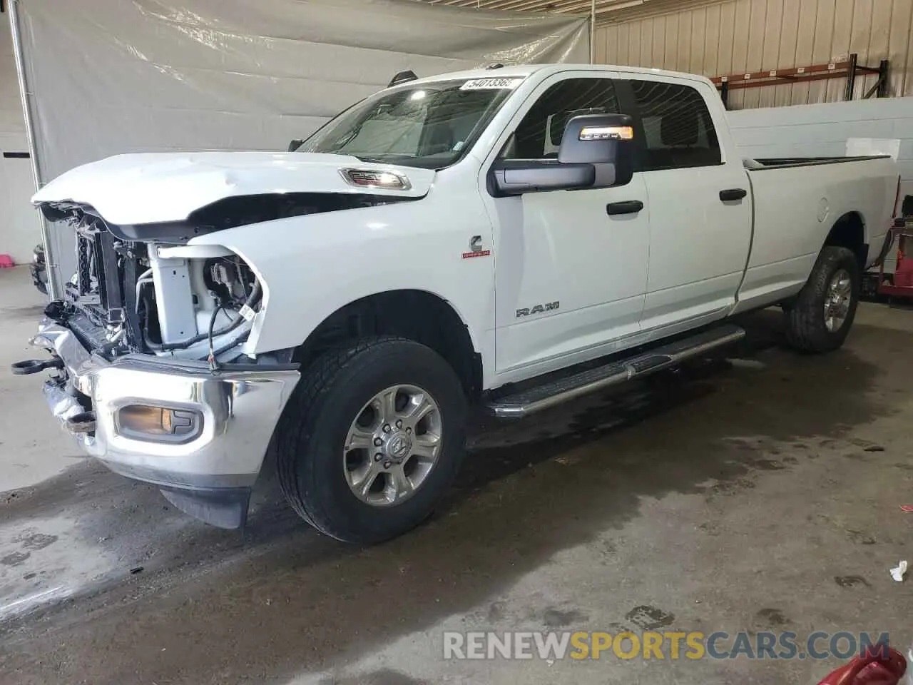 1 Photograph of a damaged car 3C6UR5JL6PG587668 RAM 2500 2023