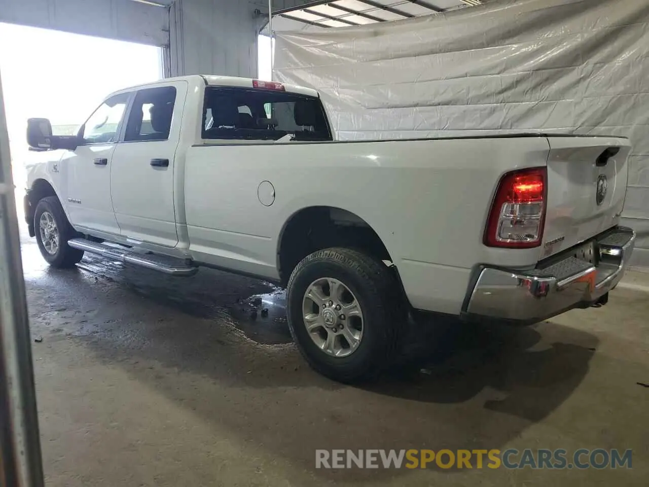 2 Photograph of a damaged car 3C6UR5JL6PG587668 RAM 2500 2023