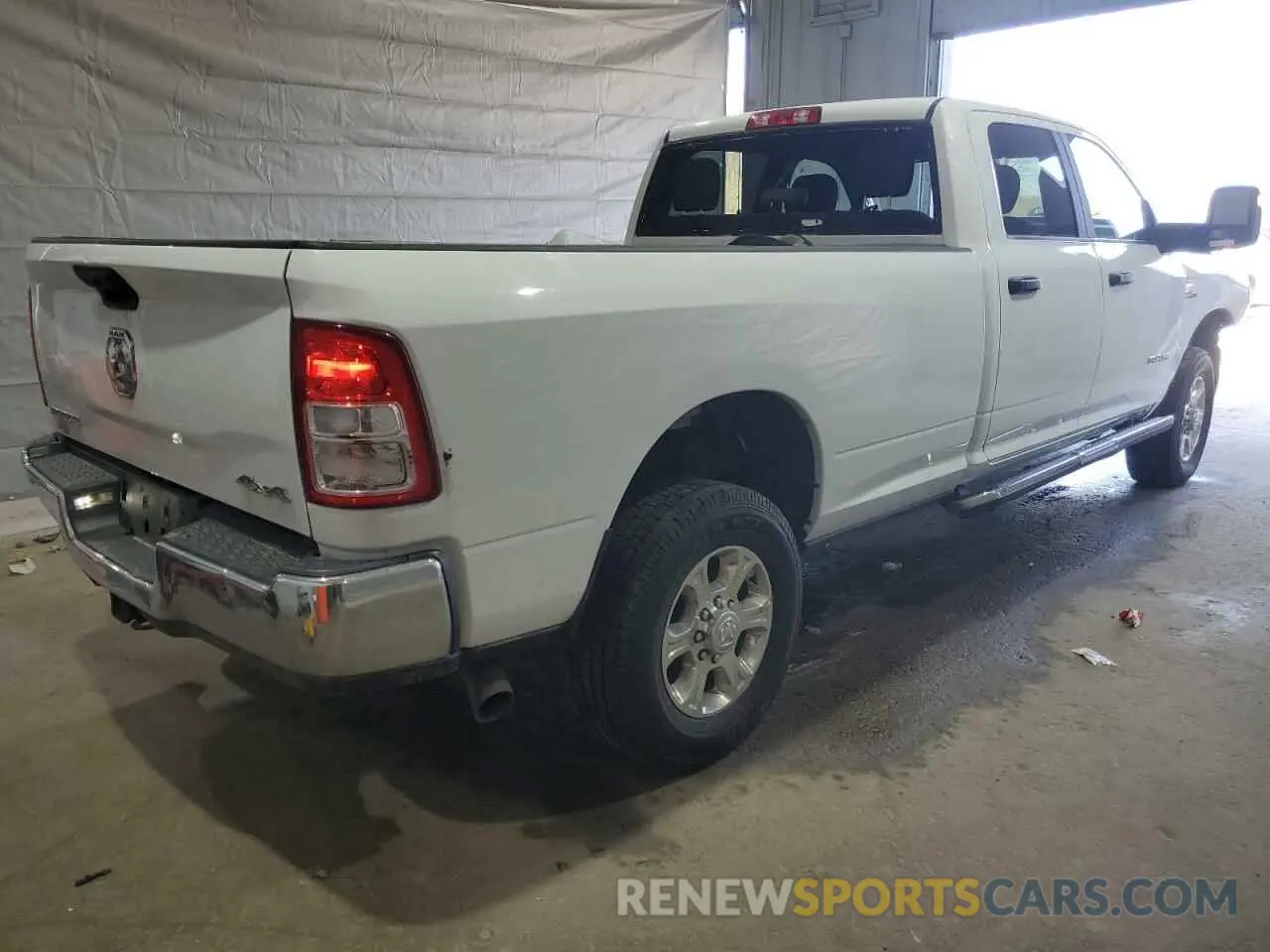 3 Photograph of a damaged car 3C6UR5JL6PG587668 RAM 2500 2023