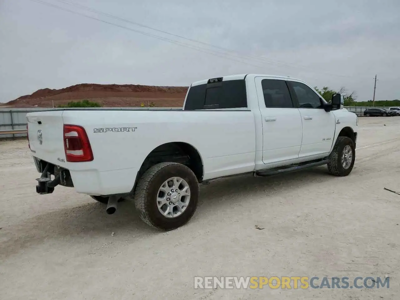 3 Photograph of a damaged car 3C6UR5KL4PG549631 RAM 2500 2023