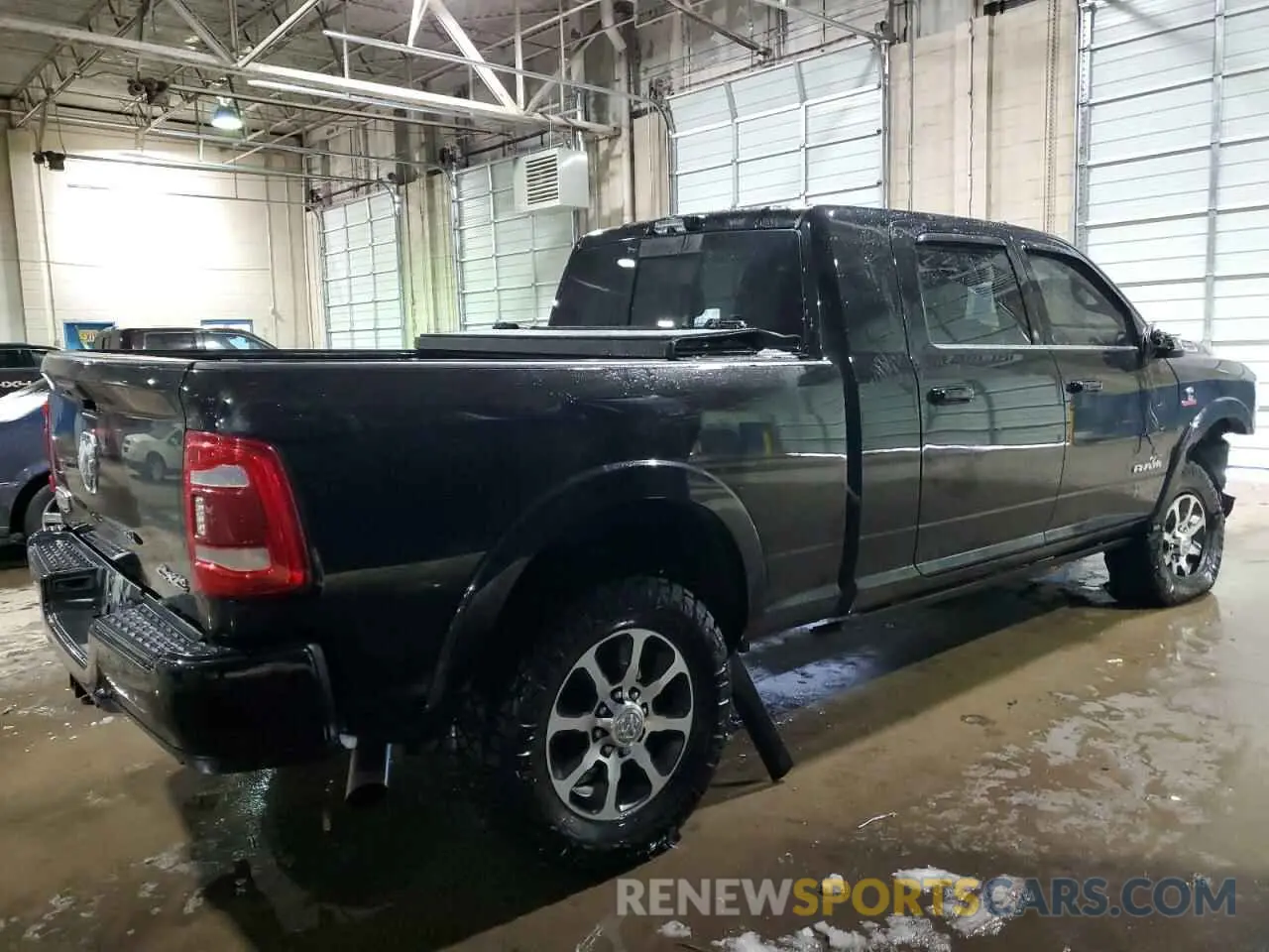 3 Photograph of a damaged car 3C6UR5PL8PG591647 RAM 2500 2023