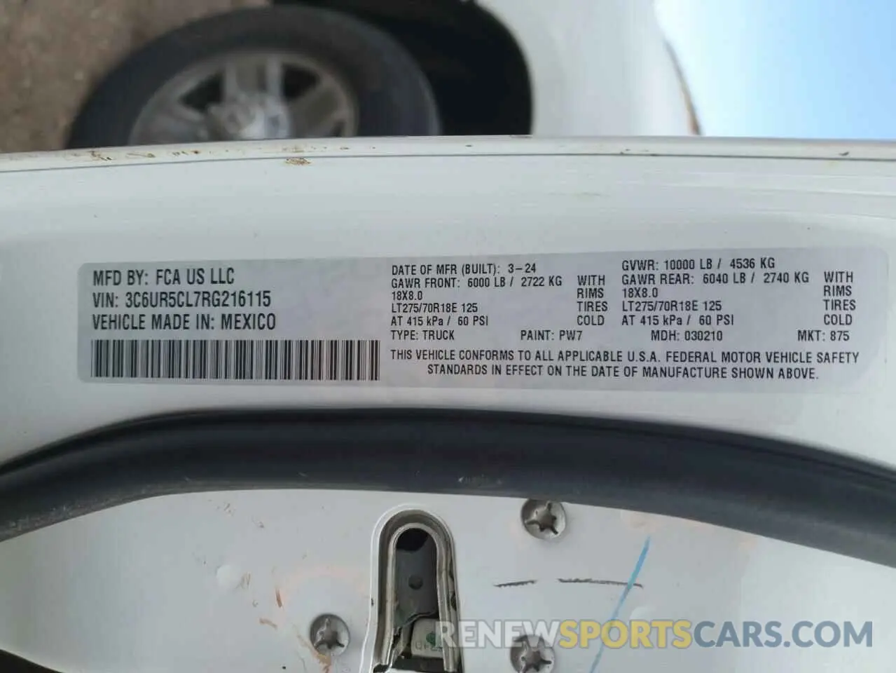 12 Photograph of a damaged car 3C6UR5CL7RG216115 RAM 2500 2024