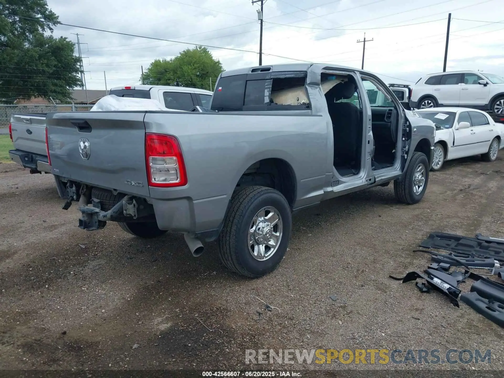 4 Photograph of a damaged car 3C6UR5CL8RG212784 RAM 2500 2024