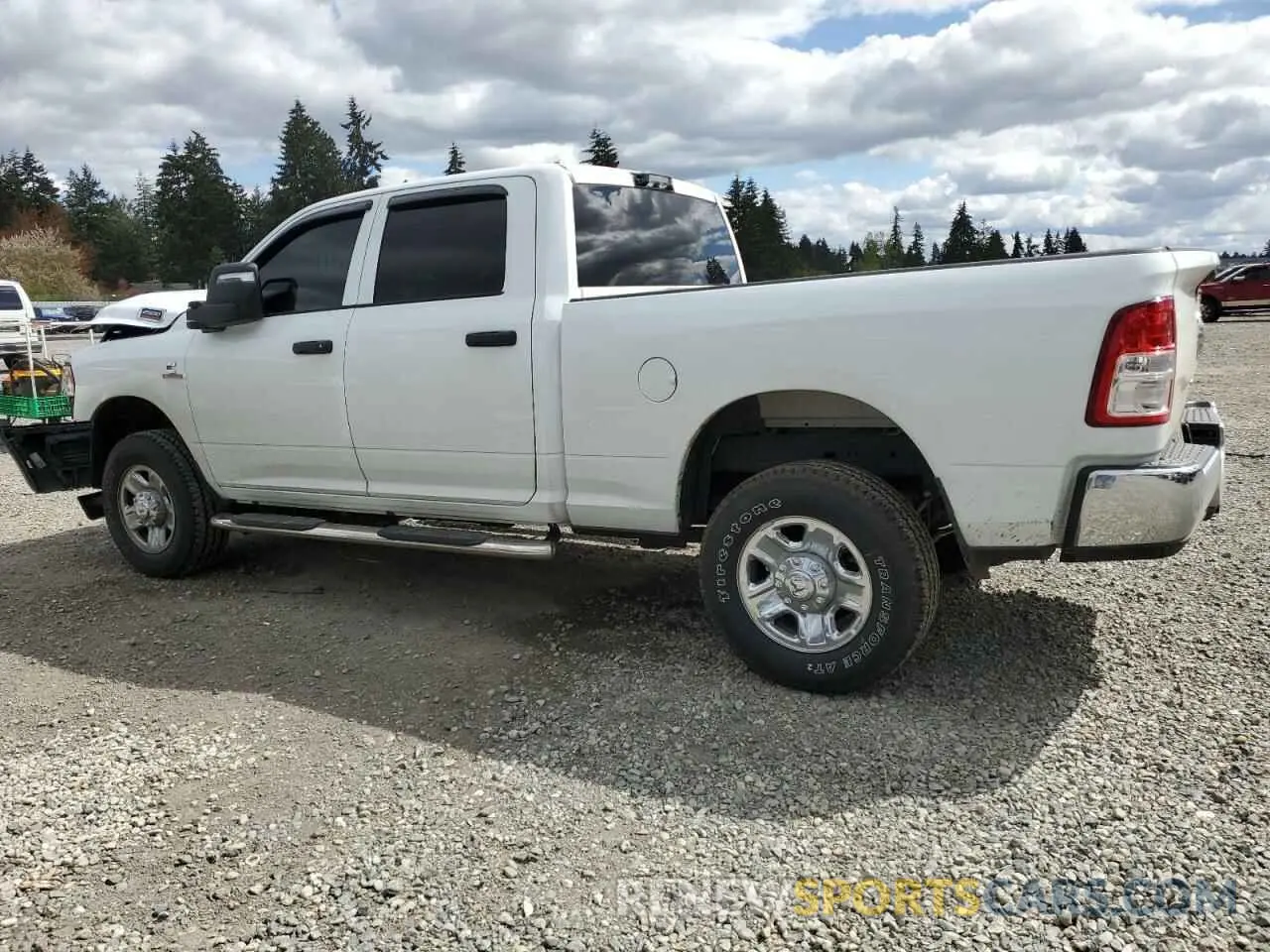 2 Photograph of a damaged car 3C6UR5CL8RG298811 RAM 2500 2024