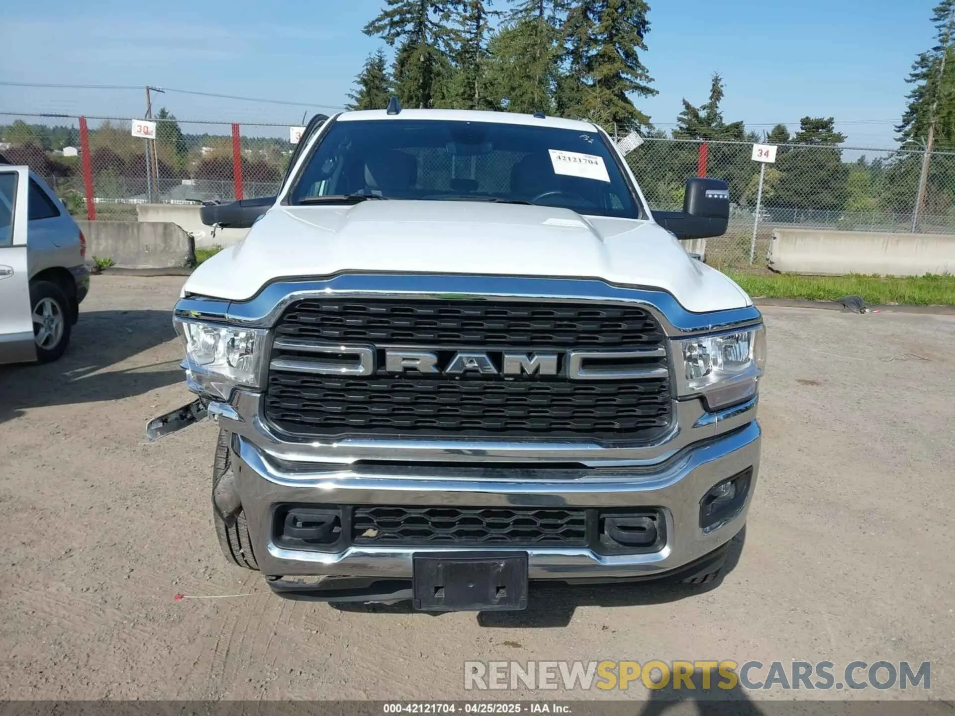 12 Photograph of a damaged car 3C6UR5DJ3RG275904 RAM 2500 2024