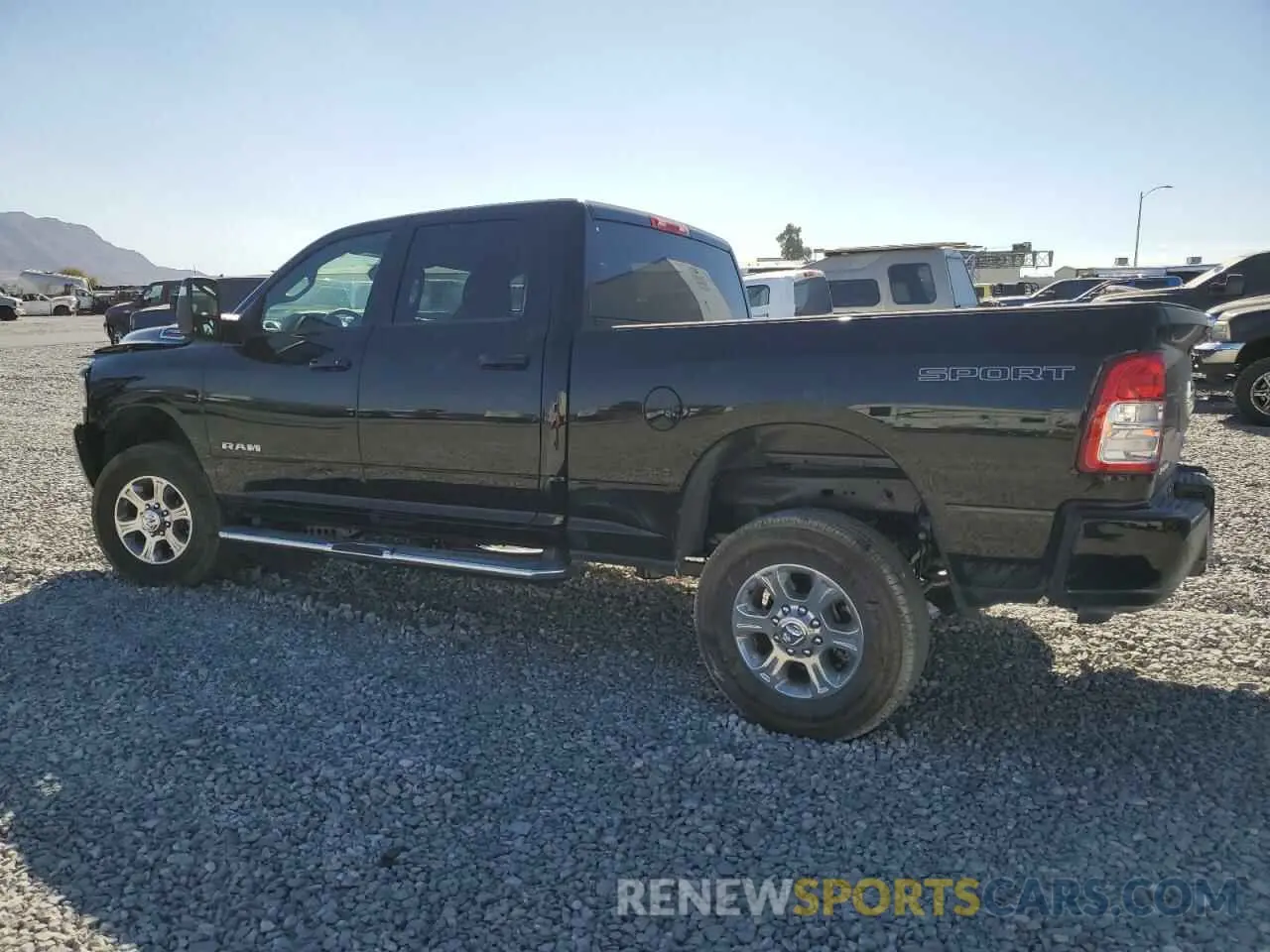 2 Photograph of a damaged car 3C6UR5DJ3RG387103 RAM 2500 2024