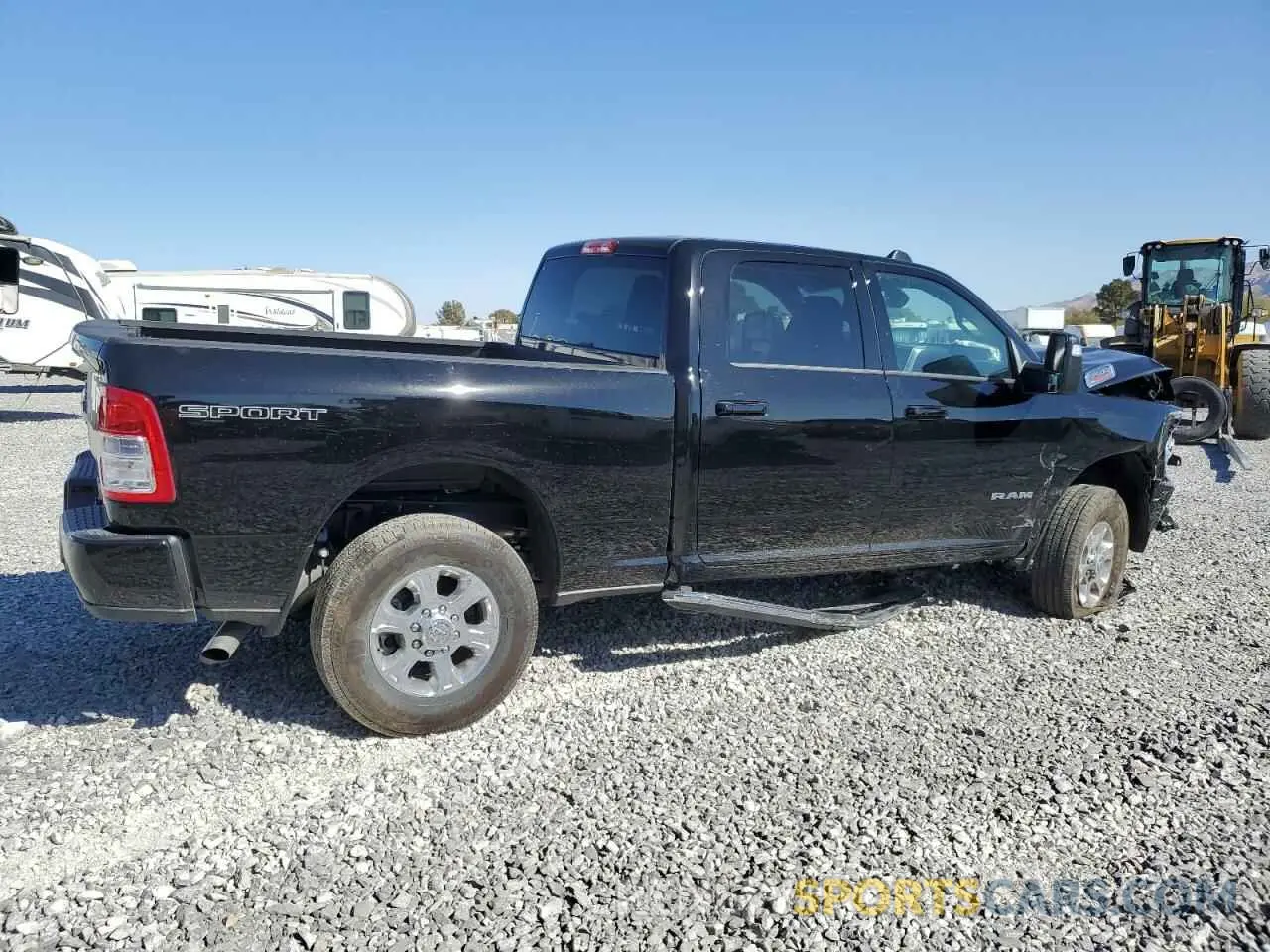 3 Photograph of a damaged car 3C6UR5DJ3RG387103 RAM 2500 2024