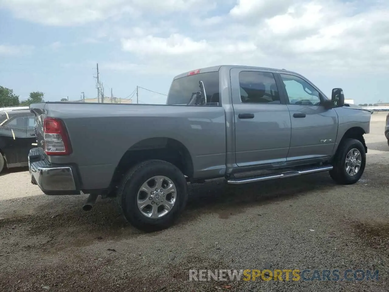 3 Photograph of a damaged car 3C6UR5DJ3RG406510 RAM 2500 2024
