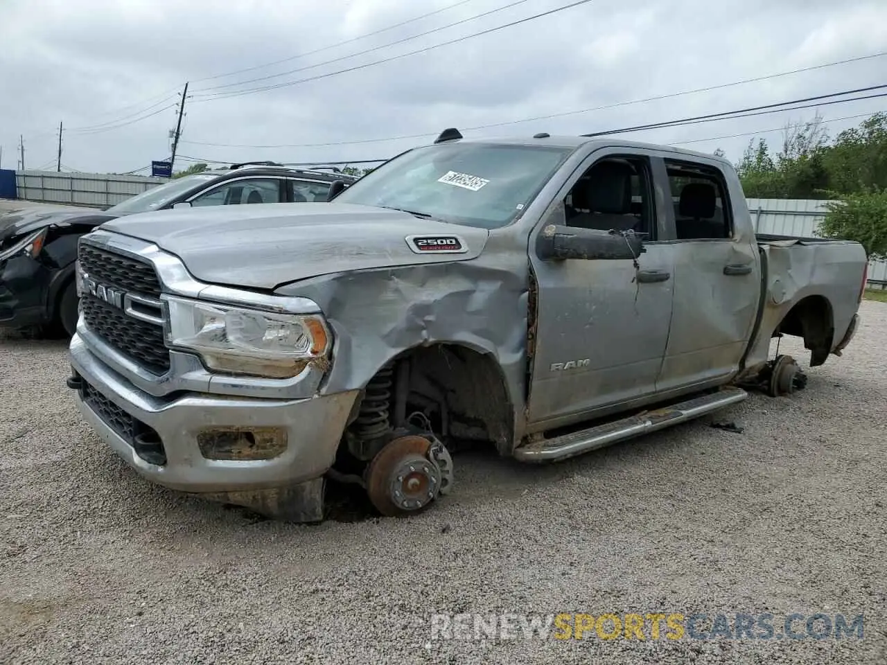 1 Photograph of a damaged car 3C6UR5DJ4RG348231 RAM 2500 2024