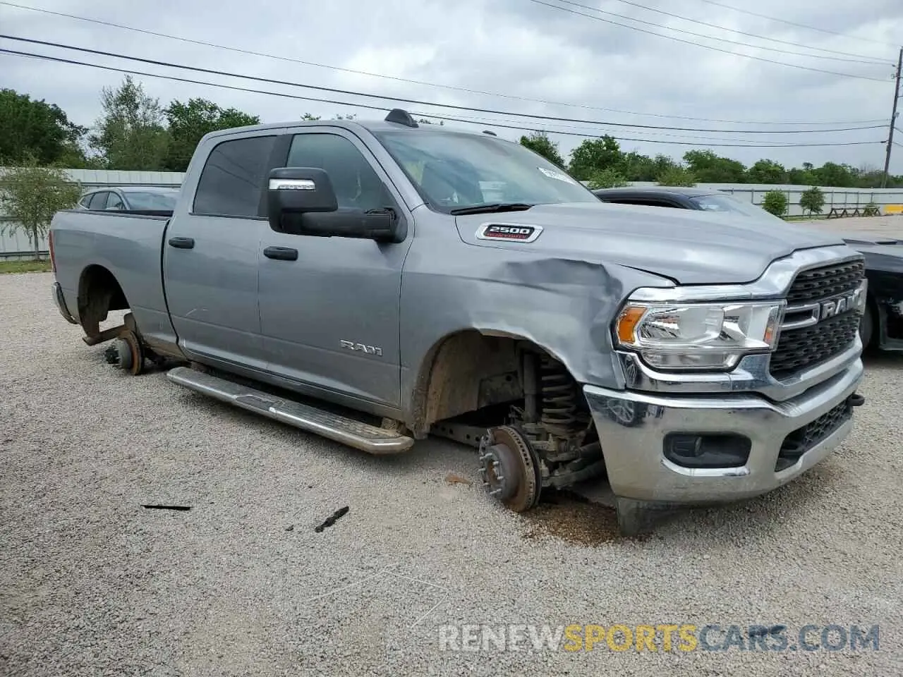 4 Photograph of a damaged car 3C6UR5DJ4RG348231 RAM 2500 2024