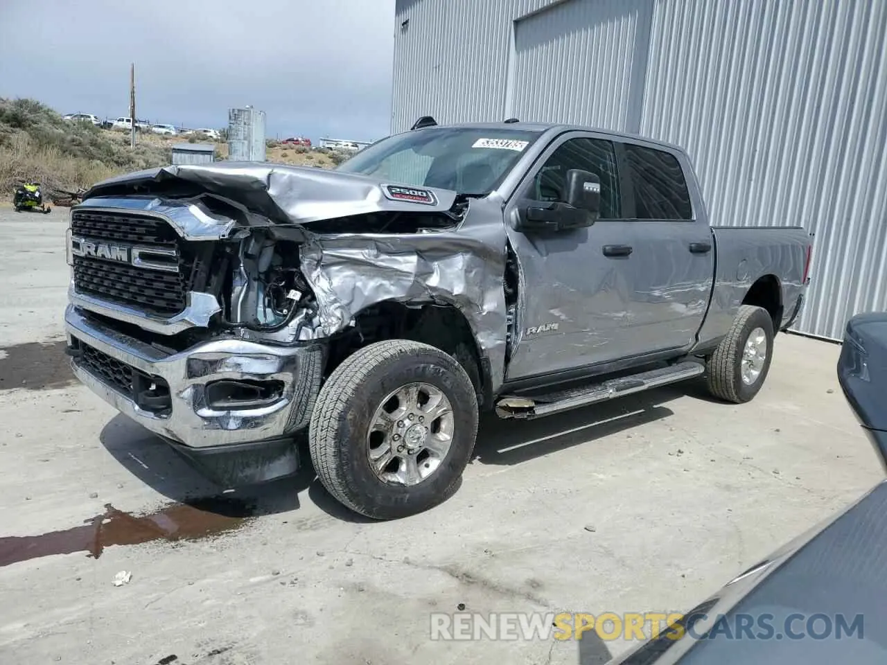 1 Photograph of a damaged car 3C6UR5DJ6RG385894 RAM 2500 2024