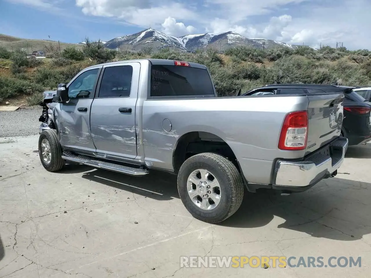 2 Photograph of a damaged car 3C6UR5DJ6RG385894 RAM 2500 2024