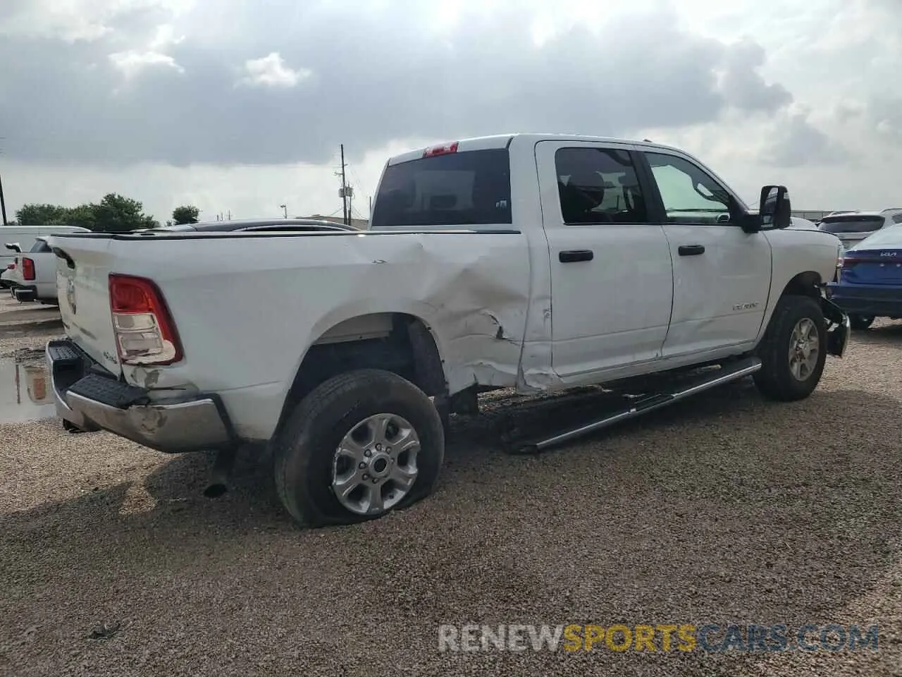3 Photograph of a damaged car 3C6UR5DJ7RG412973 RAM 2500 2024