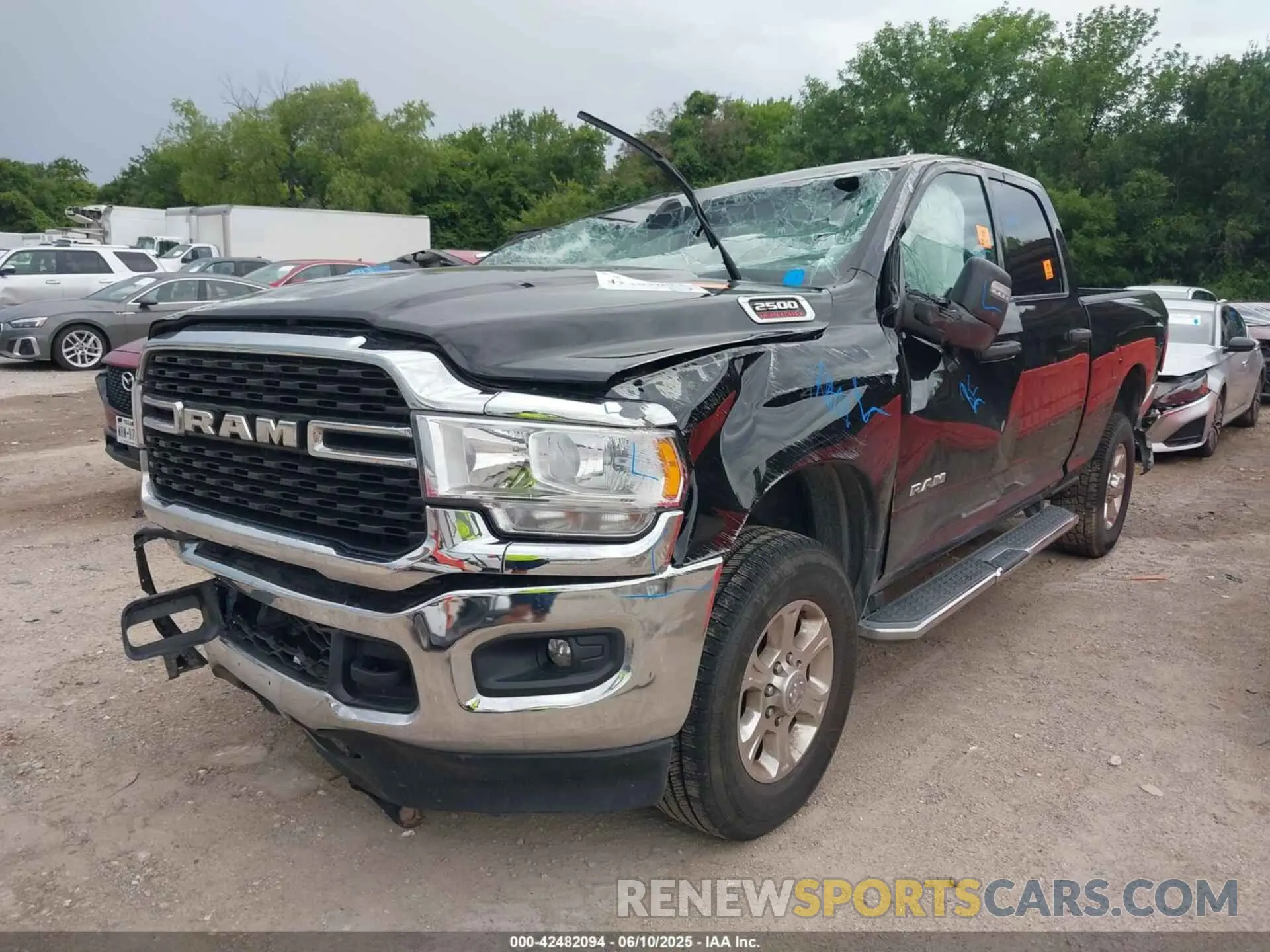 2 Photograph of a damaged car 3C6UR5DJ9RG365218 RAM 2500 2024