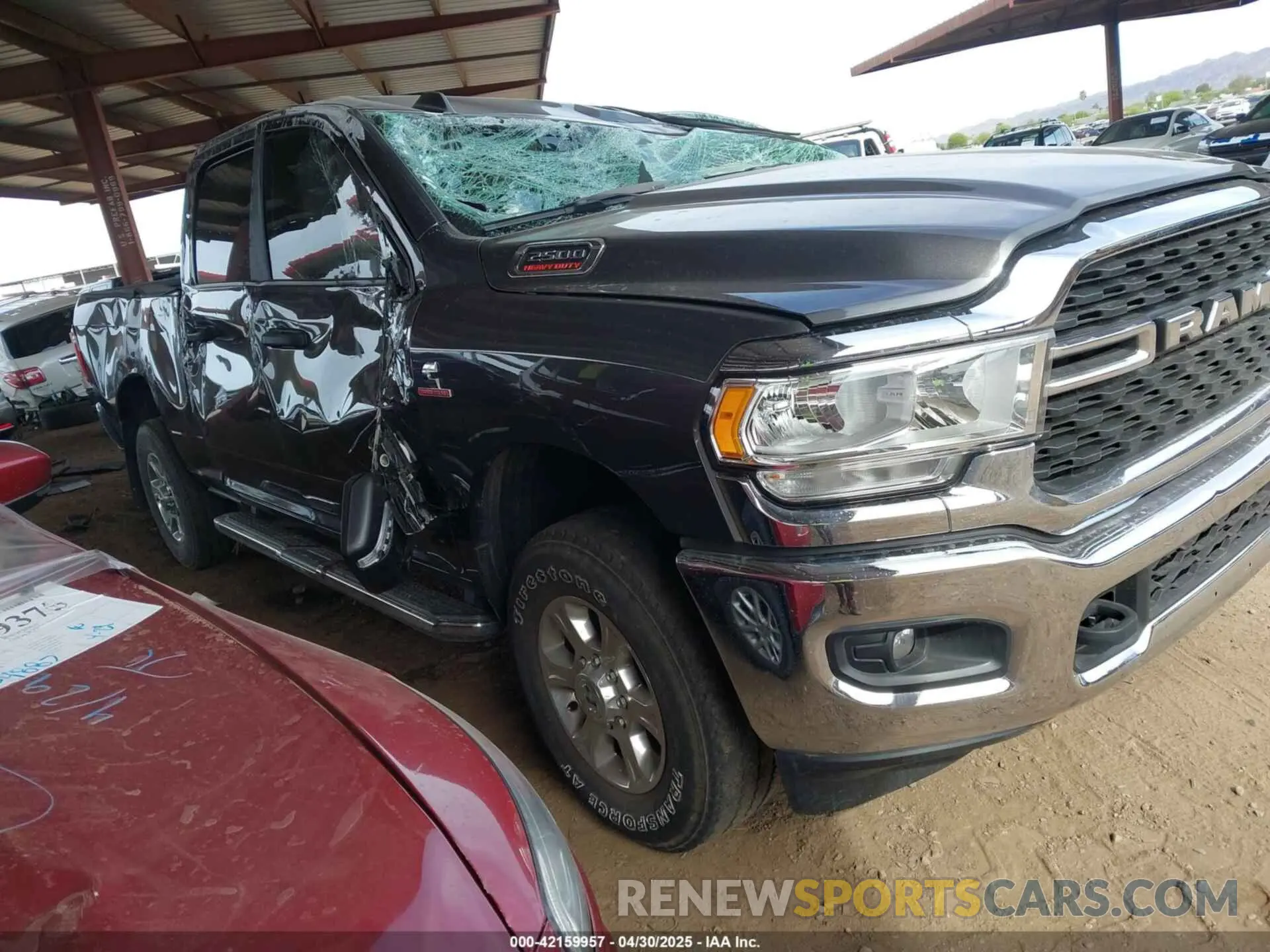 1 Photograph of a damaged car 3C6UR5DL1RG105526 RAM 2500 2024