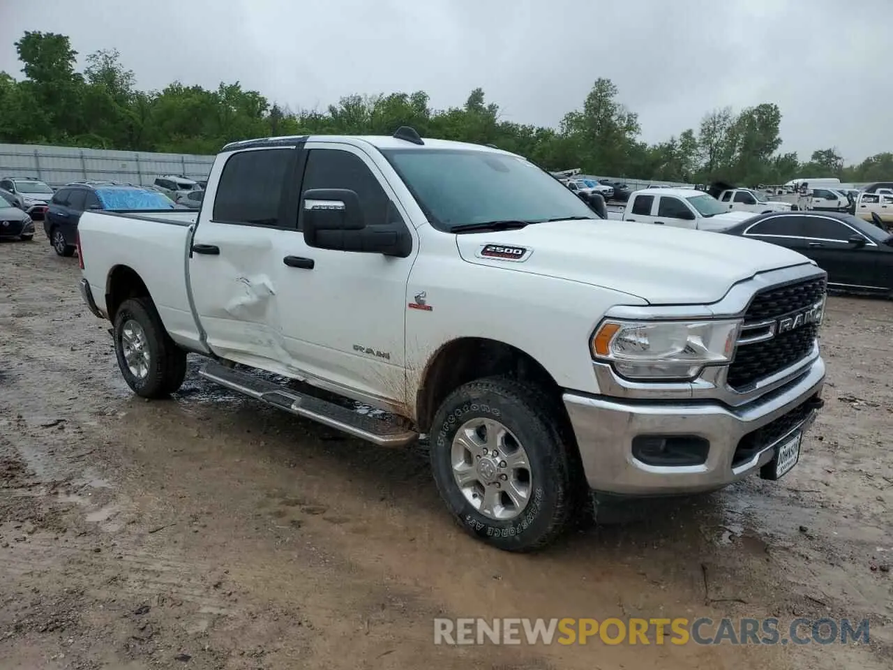 4 Photograph of a damaged car 3C6UR5DL4RG384549 RAM 2500 2024